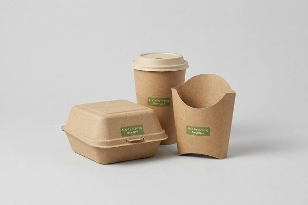 PFAS-Free Recyclable Packaging Three brown fiber-based food containers, including a clamshell, cup, and fry holder, each with a green label stating 'PFAS-Free Coating Recyclable'.