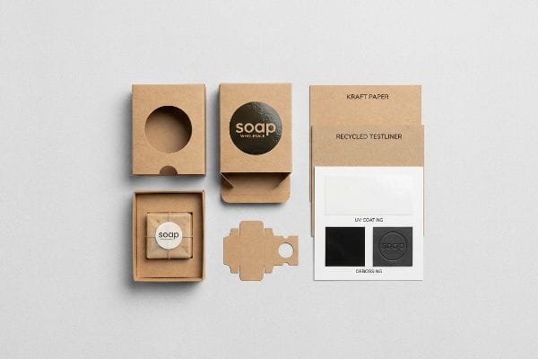 Wholesale Soap Box Samples Custom 'soap' packaging options: kraft paper boxes, wrapped bar, and material samples showing Recycled Testliner, UV Coating, and Debossing.