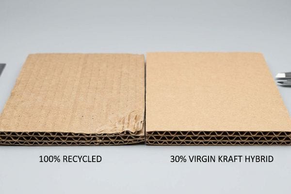 Recycled vs Virgin Kraft Corrugated cardboard comparison showing 100% Recycled board with rougher flutes next to smoother 30% Virgin Kraft Hybrid.