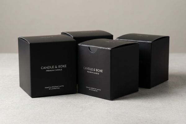Premium Black Candle Boxes Scratch-resistant matte PP lamination on four black Candle & Boxe Premium Candle boxes.