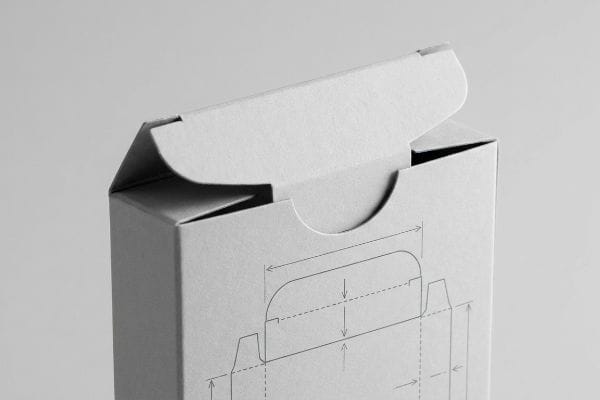 Tuck Box Design Diagram Close-up of a partially open white tuck box, revealing its friction-lock flap and a technical diagram showing packaging design measurements.