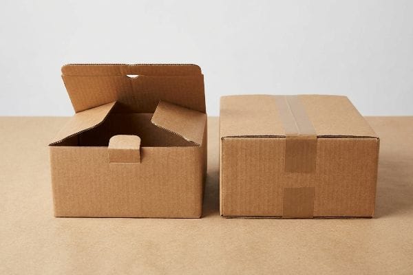A comparison of two brown cardboard boxes: an open self-locking tuck packaging box and a closed regular packaging box sealed with tape.