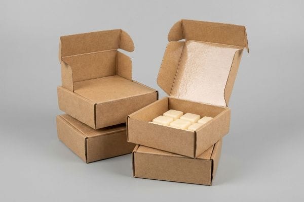 Nine Square Wax Melts Packaging Unbleached kraft wax melt packaging boxes, one open displaying nine square fragrance melts.