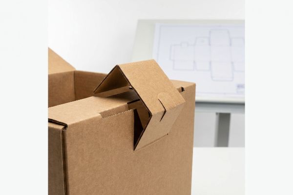 Corrugated Box Paper Friction Lock Brown corrugated cardboard box showing an interlocking paper tab friction lock for sustainable packaging design.